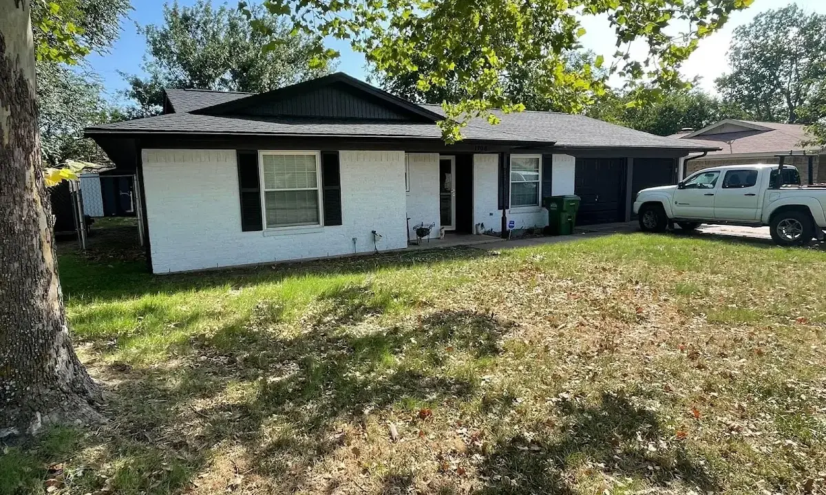 Professional roofing crew working on a residential roof in Greenville
