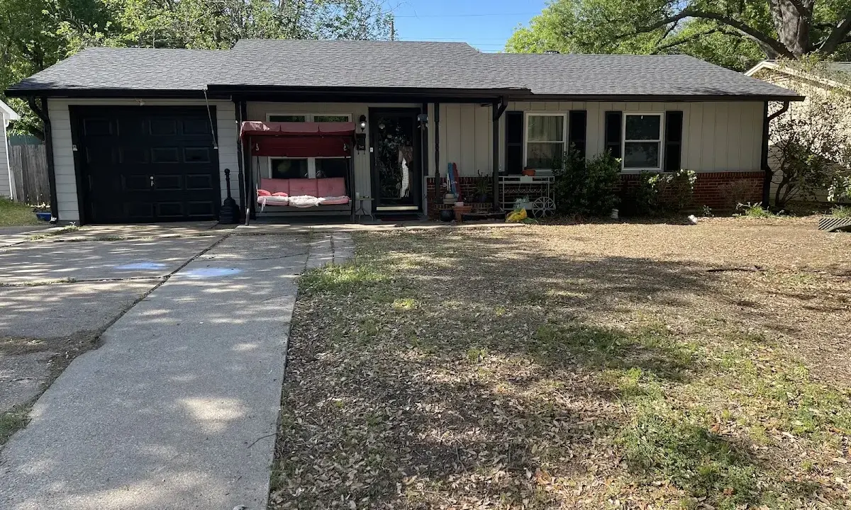 Asphalt Shingle Roof Repair crew at work on a residential roof in Greenville